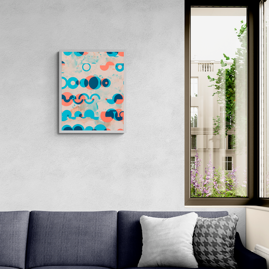 Gray sectional sofa with decorative pillows in a living room setting, featuring a colorful abstract painting on the wall.