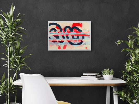 Abstract artwork on a black wall above a white desk with plants.
